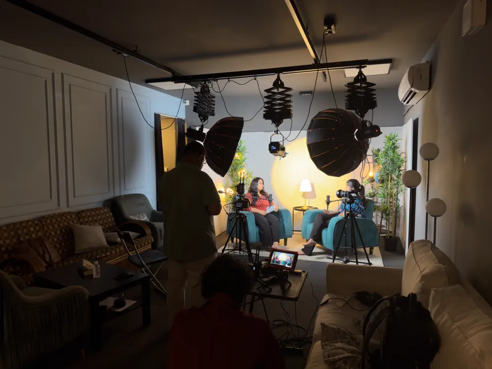 Crew filming a conversation